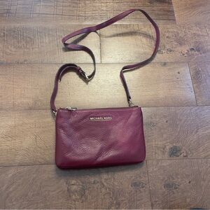 Maroon triple zip Michael Kors crossbody bag